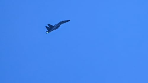 A Chinese military jet flies over Pingtan island, one of mainland China's closest point from Taiwan