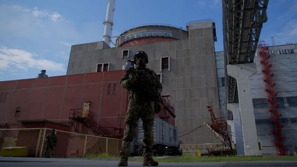 A Russian serviceman stands guard outside the second reactor of the Zaporizhzhia nuclear power station in May