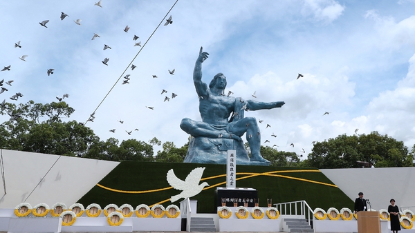 Doves are released into the air during a memorial ceremony at the Peace Park in Nagasaki