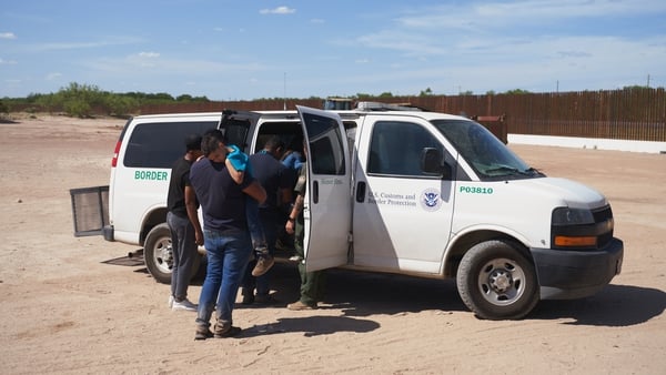 US Border Patrol pick up people who illegally crossed into Eagle Pass, Texas from Mexico