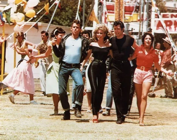 Sandy and the stars from Grease (Alamy/PA)
