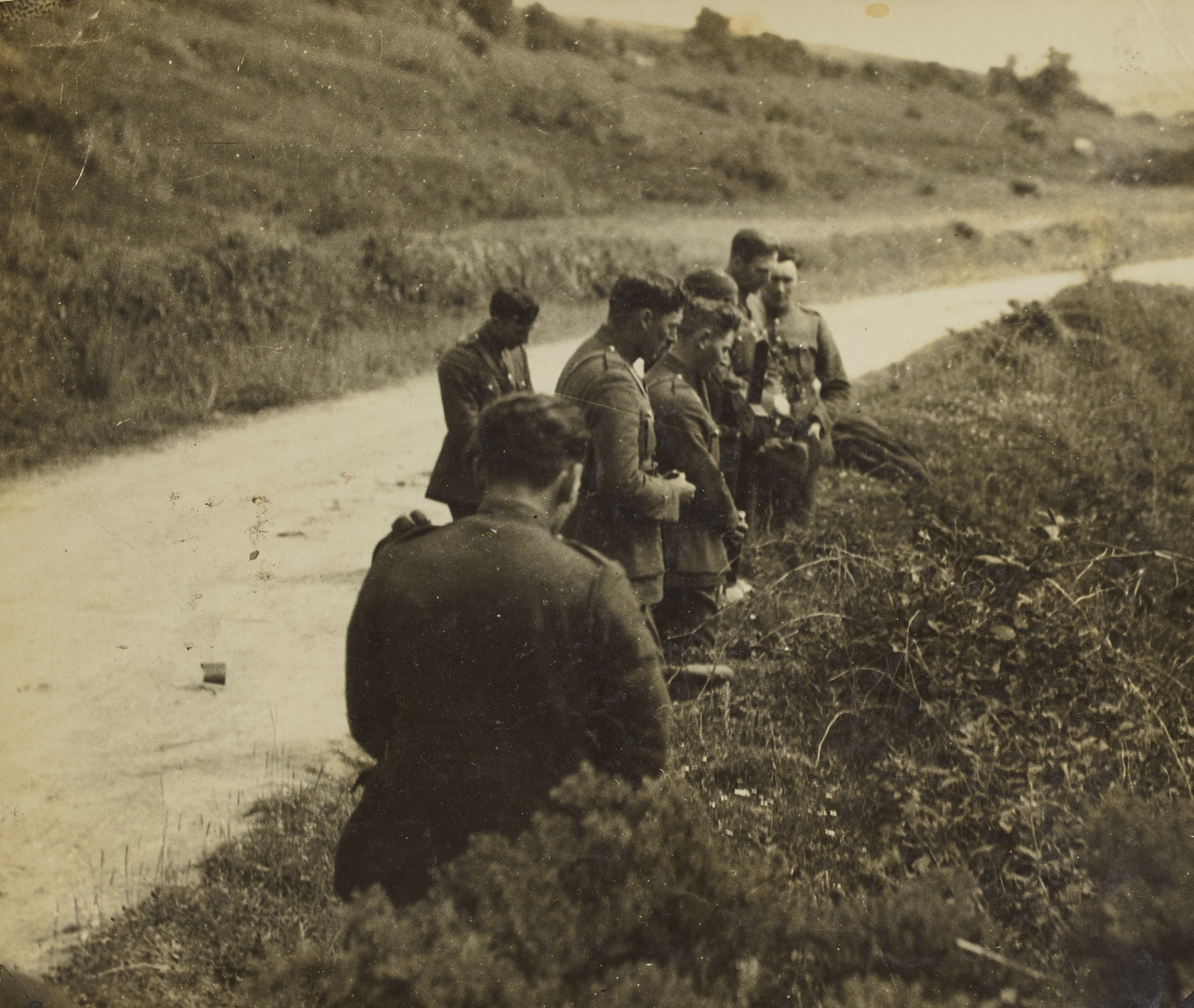 Image - Days after the ambush, soldiers pray at the spot Collins was shot (Pic: National Library of Ireland)