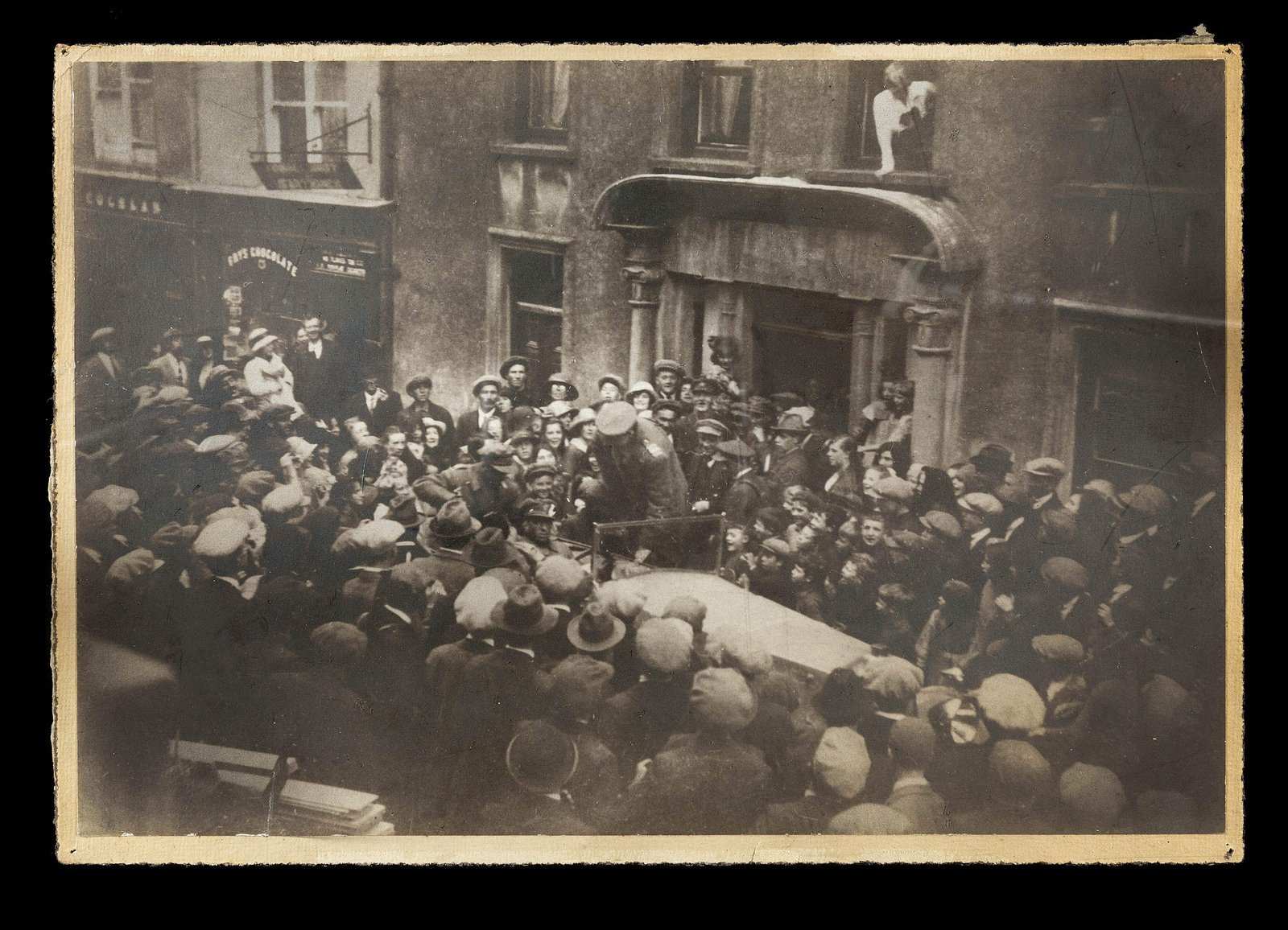 Image - Michael Collins gets into the Touring car outside Eldon's Hotel in Skibbereen, to begin the return journey that would end at Béal na Bláth. To the very end, crowds cheered him (Pic: Cork Public Museum)