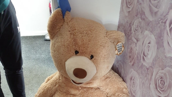 The suspect was nowhere to be seen, until the officers noticed that a large teddy bear was breathing
