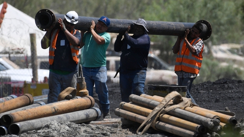 Rescuers continued today to try and reach 10 miners trapped in a flooded coal mine in Mexico