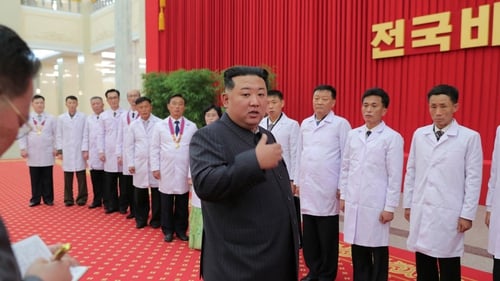 Kim Jong-un speaks to health workers and scientists about the pandemic in Pyongyang