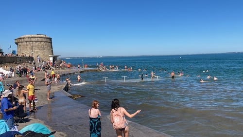 People swimming in Seapoint, Dublin, today as Met Éireann warned of soaring temperatures