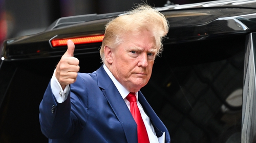 Donald Trump gives a thumbs up outside of Trump Tower in New York City