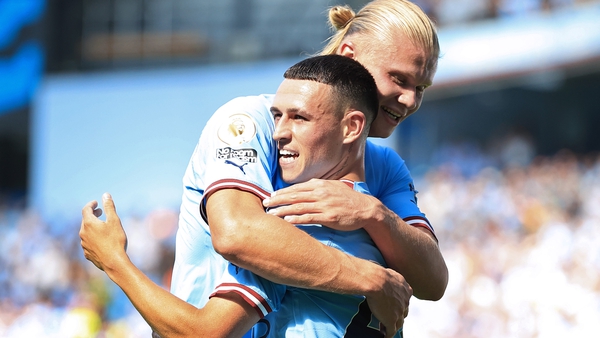 Phil Foden celebrates with Erling Haaland after scoring Manchester City's third goal