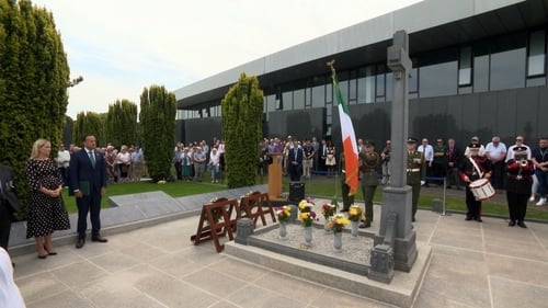 The national flag was raised and members of the men's families laid wreaths at their graves