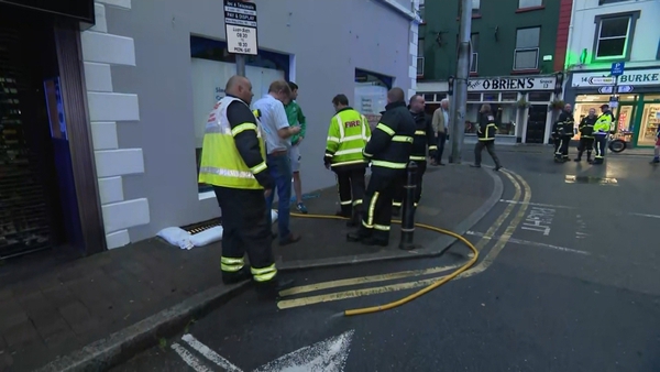 Council staff and the fire service deal with flash flooding in New Ross in Wexford