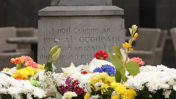Michael Collins's gravestone covered in flowers