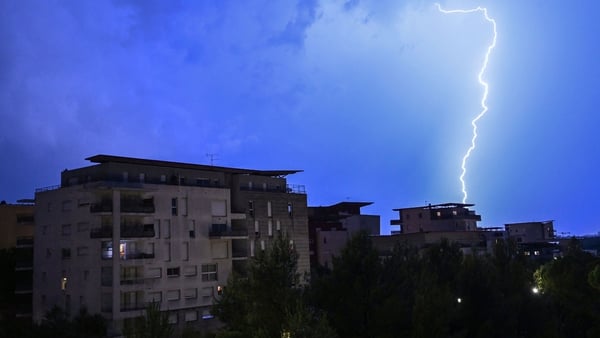 Lightning strikes over residential buildings during a thunderstorm in Montpellier
