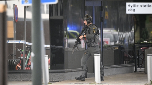 Police at the scene of the attack at the Emporia Shopping Centre in Malmo, Sweden yesterday