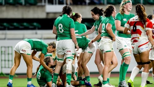 Aoife Dalton is congratulated by teammates after scoring Ireland's third try