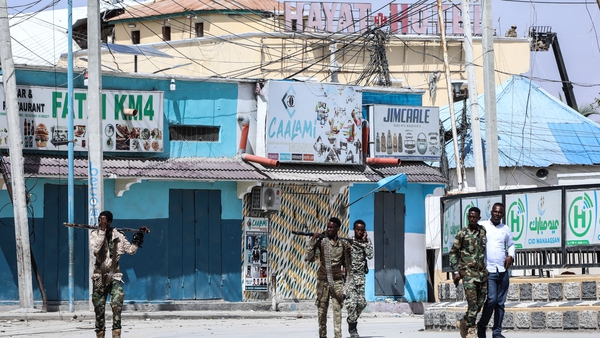 Security officers patrol near the Hayat Hotel in Mogadishu, Somalia