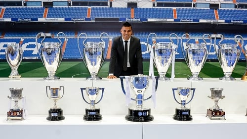 Casemiro poses with replicas of some of the trophies he has won at a farewell ceremeny at the Santiago Bernabeu