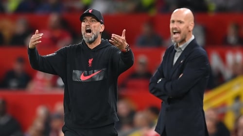 Liverpool manager Jurgen Klopp (left) and Manchester United manager Erik ten Hag (right) shout instructions at their team.
