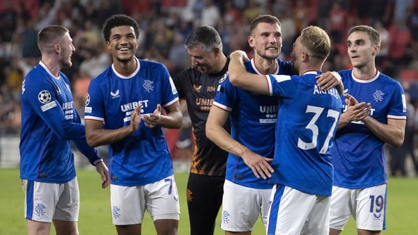 Rangers players celebrating after sealing their place in the Champions League group stage