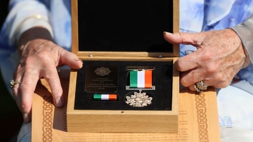 The hands of Marie Hyland, daughter of the late Detective Garda Richard Hyland, who was posthumously awarded a gold Scott medal last year