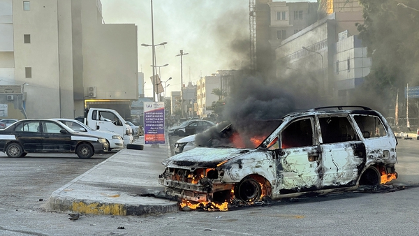 Damaged vehicles in the Libyan capital Tripoli following clashes between rival groups