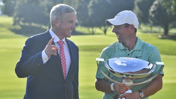 McIlroy shares a joke with PGA Tour commissioner Jay Monahan after his Tour Championship triumph