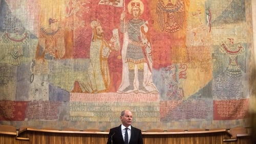 German Chancellor Olaf Scholz delivers a speech at Charles University in Prague today - Germany opposed a complete ban on Russian tourists
