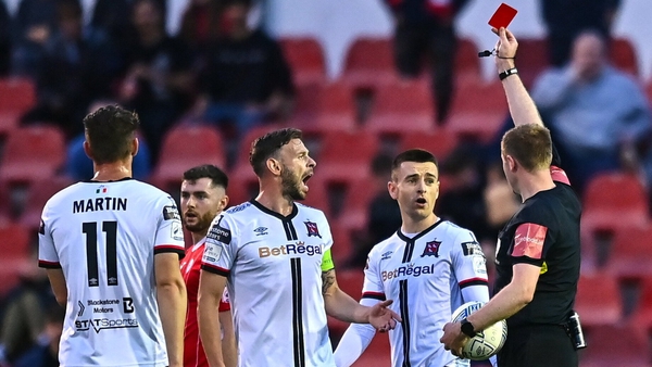 Dundalk's Darragh Leahy, second from right, is shown a red card by referee John McLoughlin