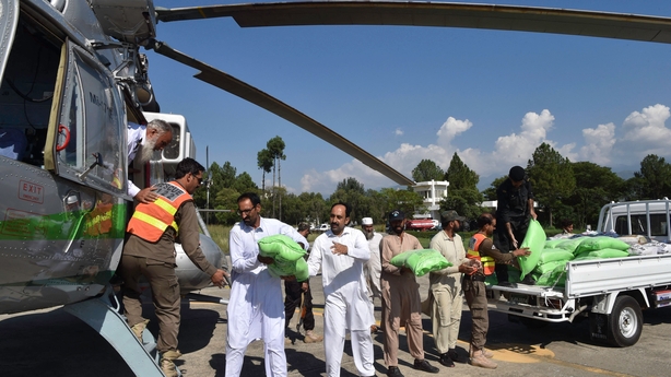 Food is loaded onto a government helicopter