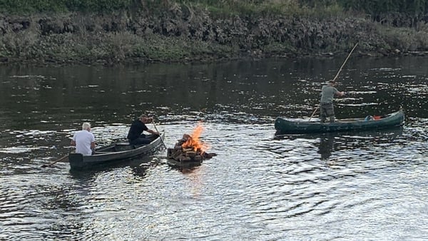 Boaters pass Kenny's Rock on the River Suir