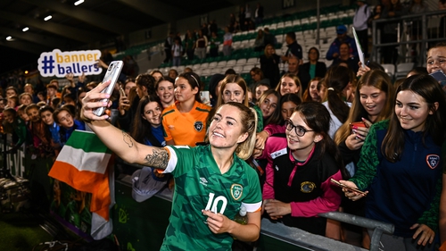 Denise O'Sullivan celebrates with some supporters after the win against Finland