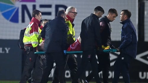 Shelbourne's Conor Kane is stretchered off the pitch
