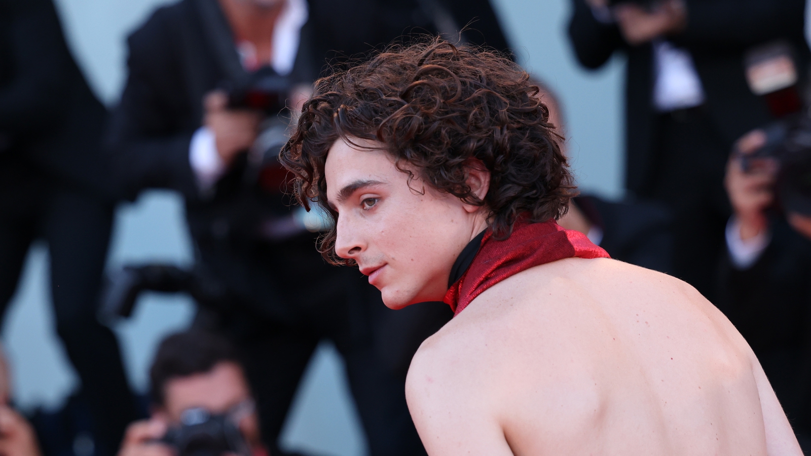 Timothee Chalamet Dons Red Backless Jumpsuit