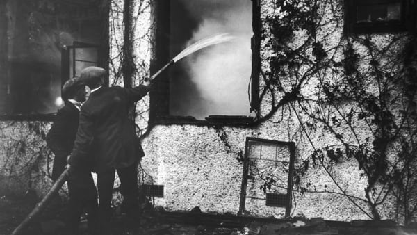 Firemen hosing down the ruins of Kilteragh, Sir Horace Plunkett's house outside Dublin, which was burned down by anti-Treaty forces in February 1923. Plunkett was a Senator of the Irish Free State. Photo: Walshe/Topical Press Agency/Hulton Archive/Getty