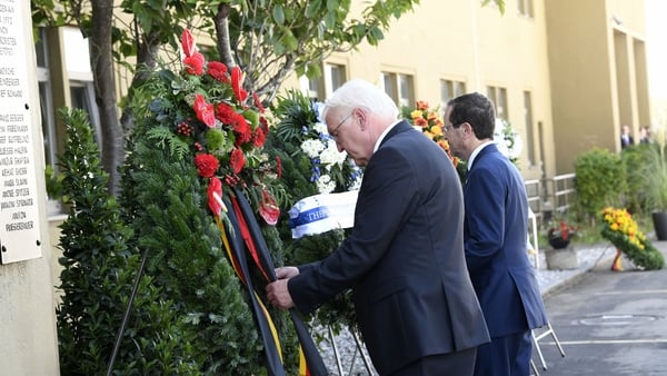 German President Frank-Walter Steinmeier (L) and Israel's President Isaac Herzog lay a wreath to mark the anniversary