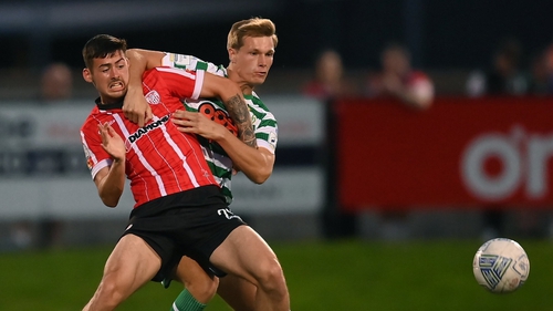 Derry's Cian Kavanagh of Derry City in action against Dan Cleary of Shamrock Rovers in last months' league clash