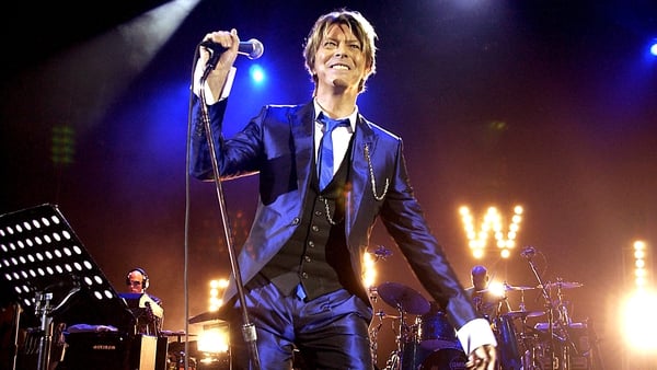 David Bowie (pictured performing at London's Hammersmith Apollo in October 2002) - Estate raising money for the humanitarian organisation CARE