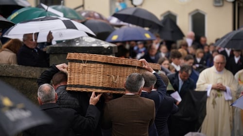 Mourners at the funeral of 13-year-old Jack de Bromhead