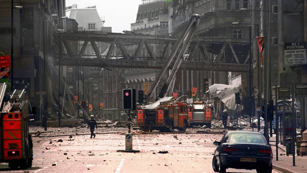 Firemen at the scene of the bomb blast in Manchester in 1996