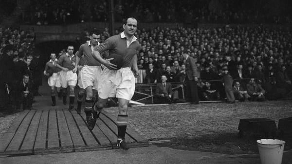 6th March 1950: Johnny Carey, the Manchester United captain, leads his team out onto the pitch. Photo: J. A. Hampton/Topical Press Agency/Getty Images