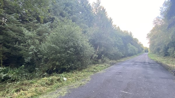 The road where two children died in a car fire has reopened