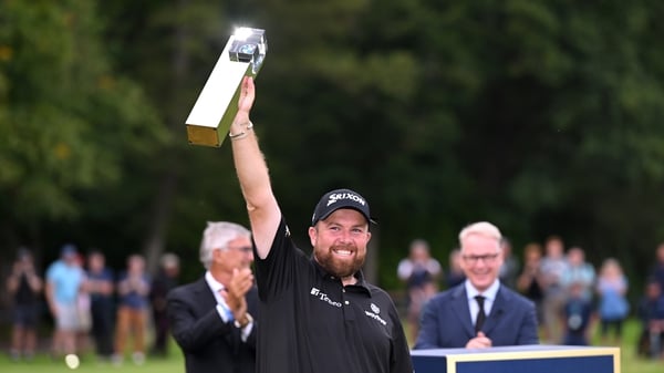 Shane Lowry celebrates with the title