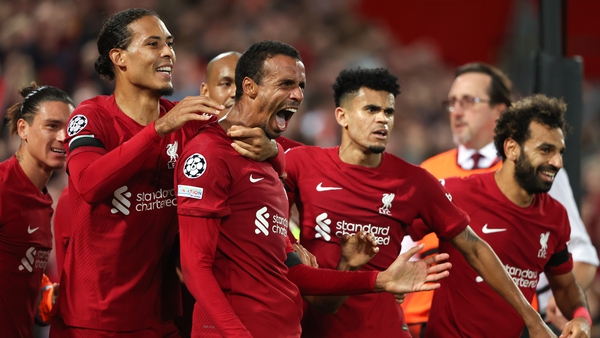 Joel Matip is mobbed after his late winner