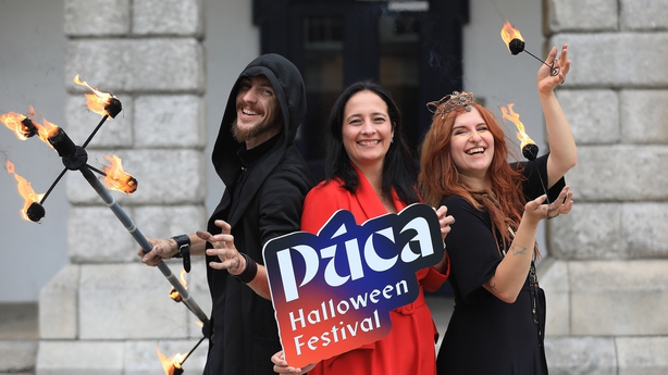 Minister for Tourism, Culture, Arts, Gaeltacht, Sport and Media Catherine Martin T.D with Fire Performers Danny and Polly 