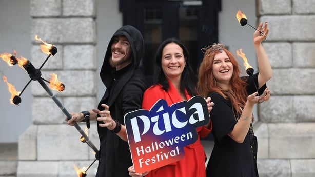 Minister for Tourism, Culture, Arts, Gaeltacht, Sport and Media Catherine Martin T.D with Fire Performers Danny and Polly
