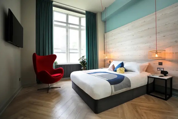A king en-suite room at Revolver in Glasgow (Revolver/PA)