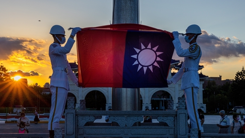 A flag-lowering ceremony takes place at Liberty Square in Taipei