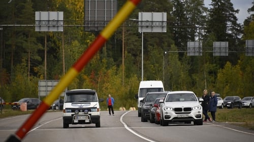 Cars coming from Russia wait in lines at the border checkpoint between Russia and Finland
