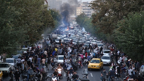 Iranian demonstrators taking to the streets of the capital Tehran during a protest for Mahsa Amini