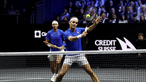 Roger Federer in action with Rafeal Nadal